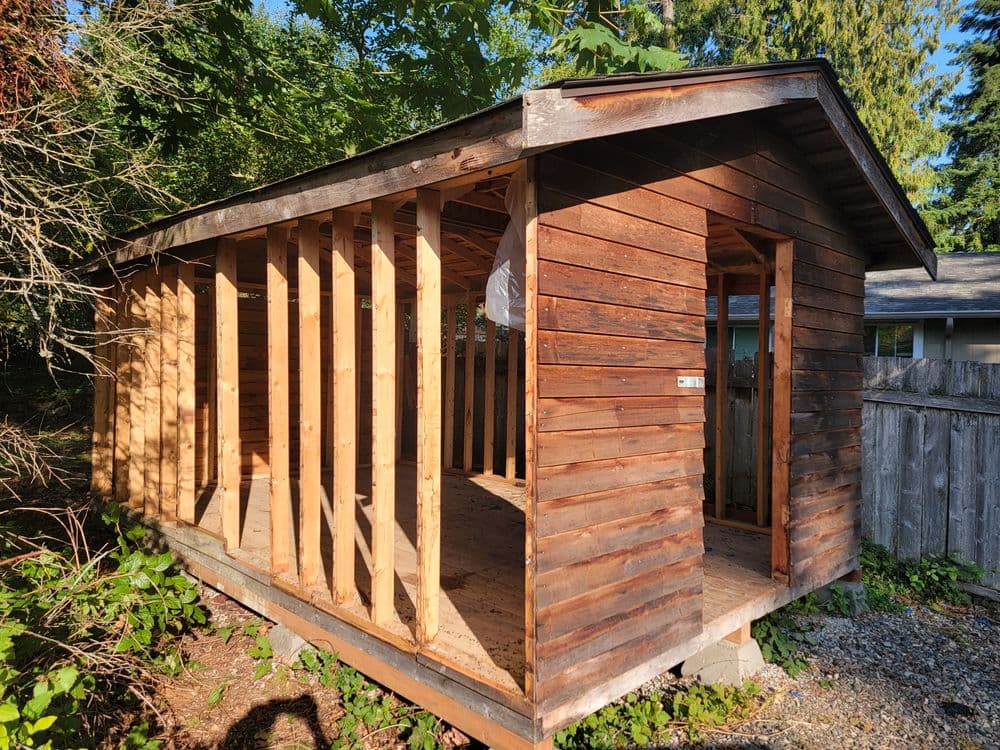 A pickup truck filled with trash ready for disposal.